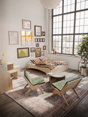 the orbit bed karup design in a loft style minimalistic apartment with artprints on the wall, join-in dining table, lounge chairs next to a coffee table