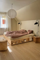 Modern bedroom with wooden bed and minimal decor