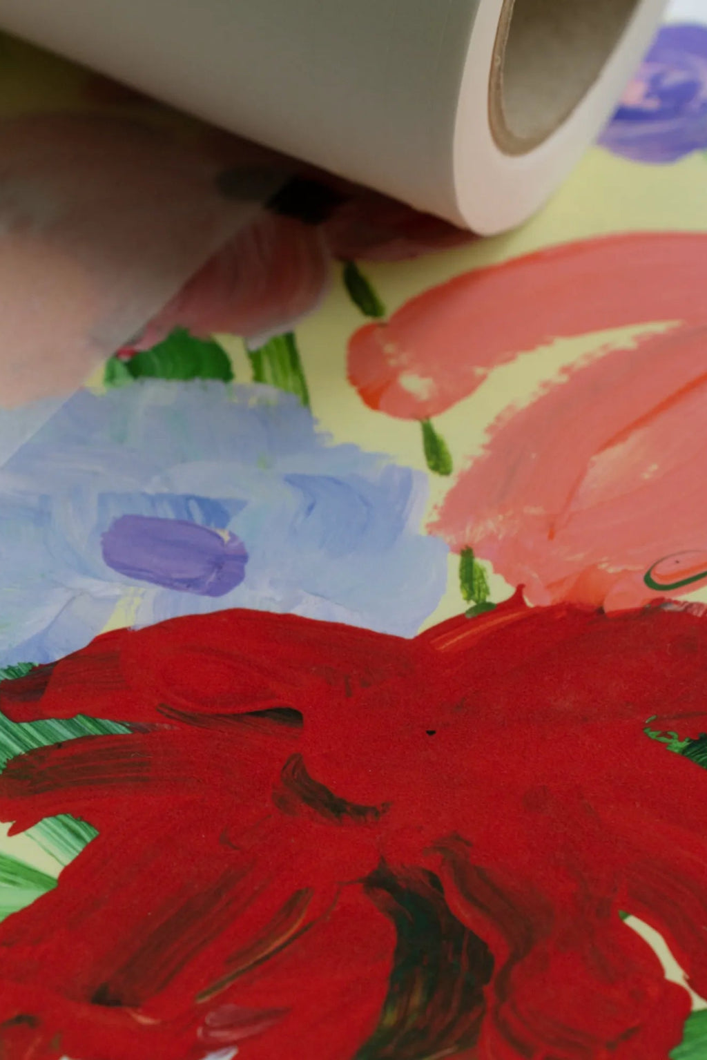 The Poster Club Flowers on Green Tablecloth, a vibrant abstract floral art print on premium paper, showcasing bold painterly brushstrokes in vivid red, soft pink, light blue, and rich purple flowers.