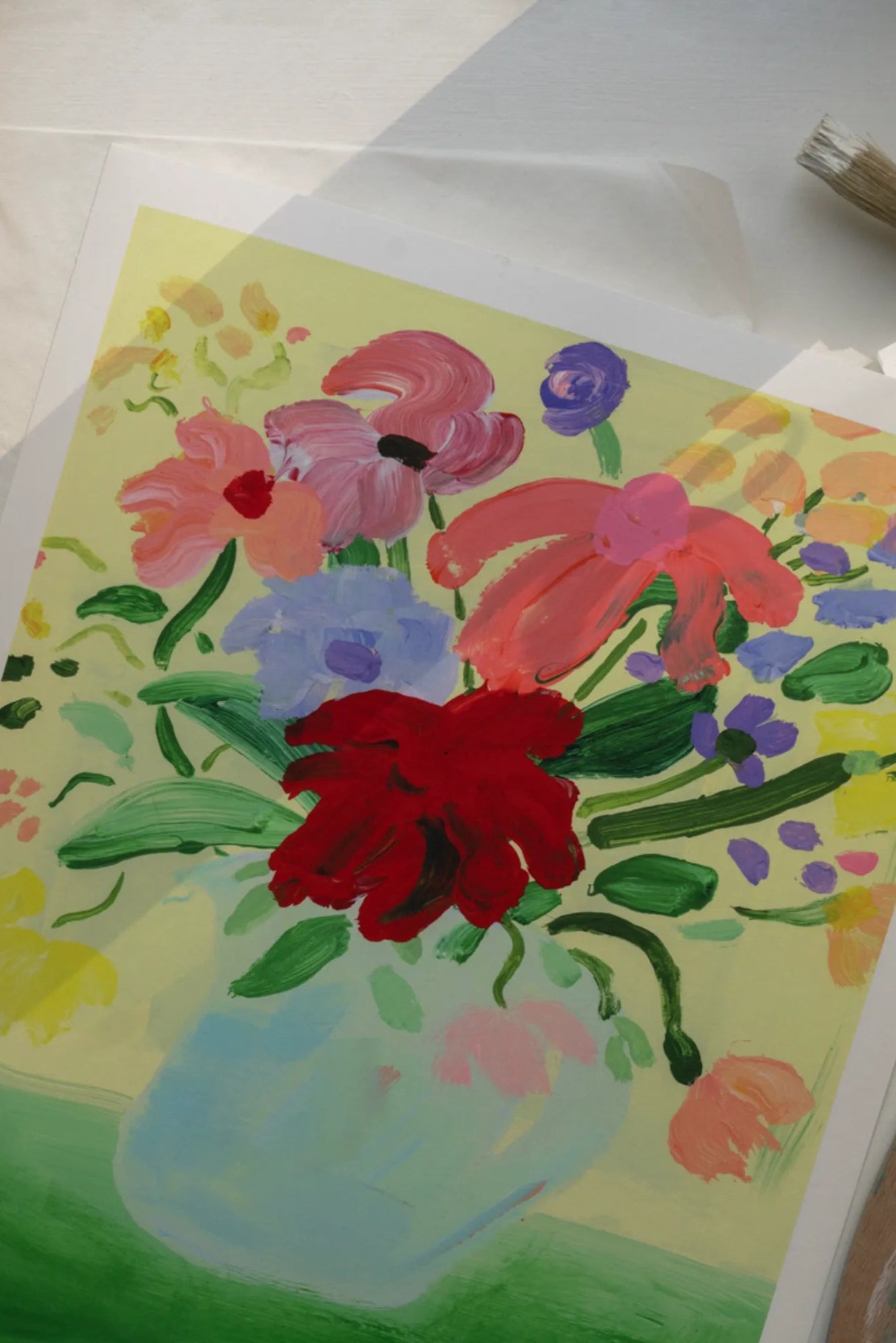 Bouquet of colorful flowers on a vibrant green tablecloth