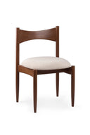 Wooden chair with a white cushion on a white background