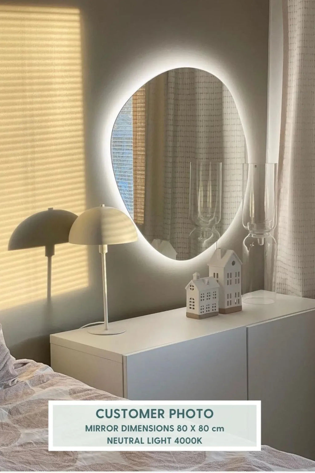 Pebble Mirror with Lights as a stylish statement piece in minimalist living room