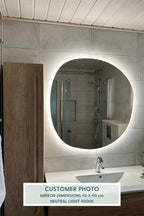 Pebble mirror with lights reflecting elegant and modern interior design