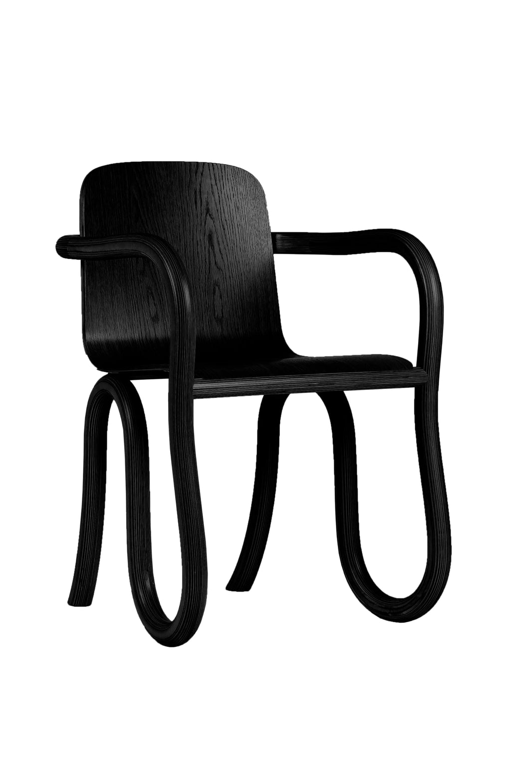 Made by Choice Kolho Dining Chair in a sleek black finish, featuring a modern, minimalist design with unique curved wooden legs and armrests, presented from a slightly different angle on a white background.
