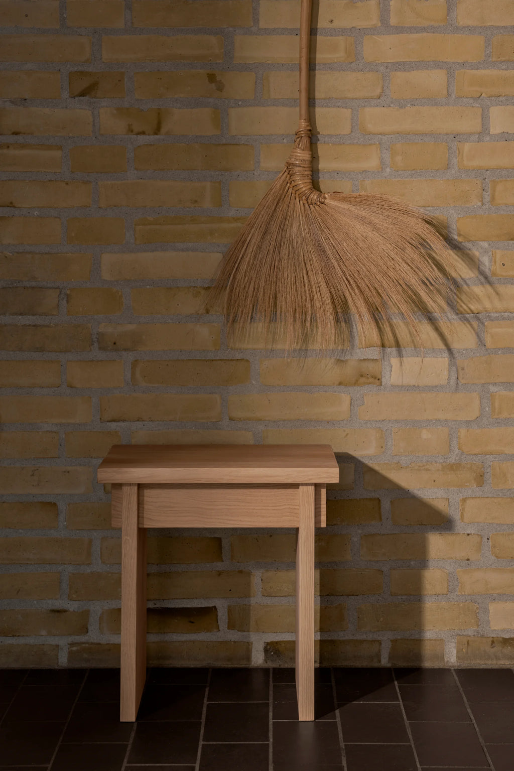 Kristina Dam Artisan Stool, a modern minimalist stool crafted from light natural solid oak wood, featuring a clean rectangular top, thick, straight legs, and a smooth, refined finish. This versatile Scandinavian design piece is perfect as a contemporary side table, accent stool, or entryway console for organic modern and Nordic-inspired interiors.