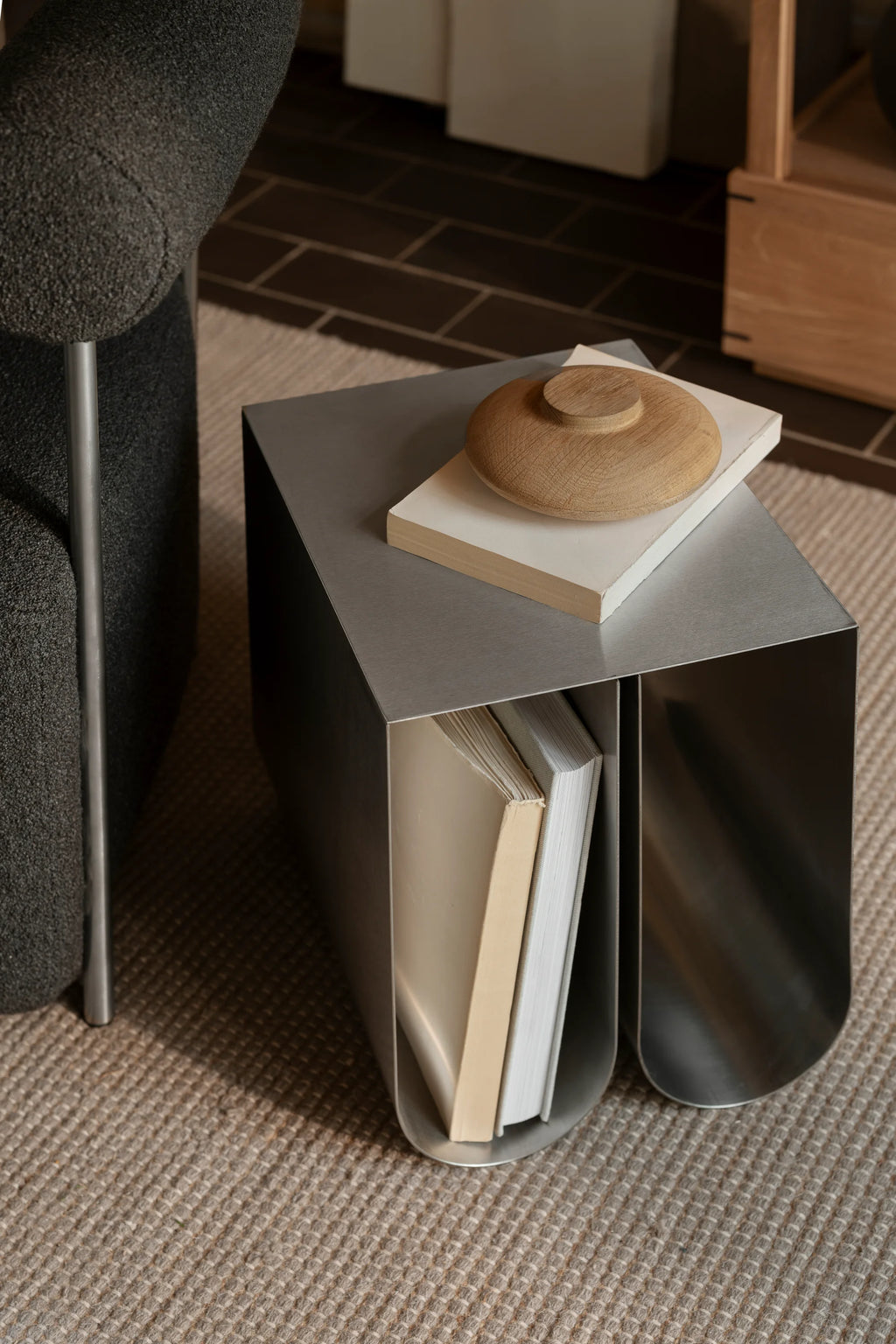 Kristina Dam Wooden Galaxy, a minimalist decorative object crafted from light natural oak with a smooth, visible wood grain and a sculptural, circular form featuring a raised central disc.