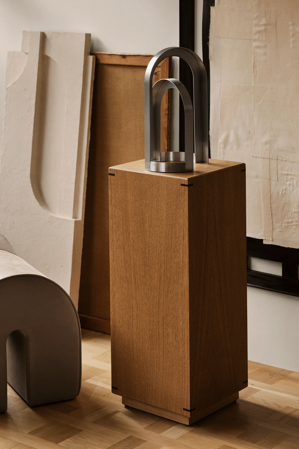 Kristina Dam Japanese Pedestal, a tall, rectangular solid oak pedestal featuring a warm natural wood finish and subtle black joint details on its minimalist architectural frame. This contemporary oak display stand is perfect for Scandinavian living rooms or Japandi bedrooms as a stylish plinth or accent table.