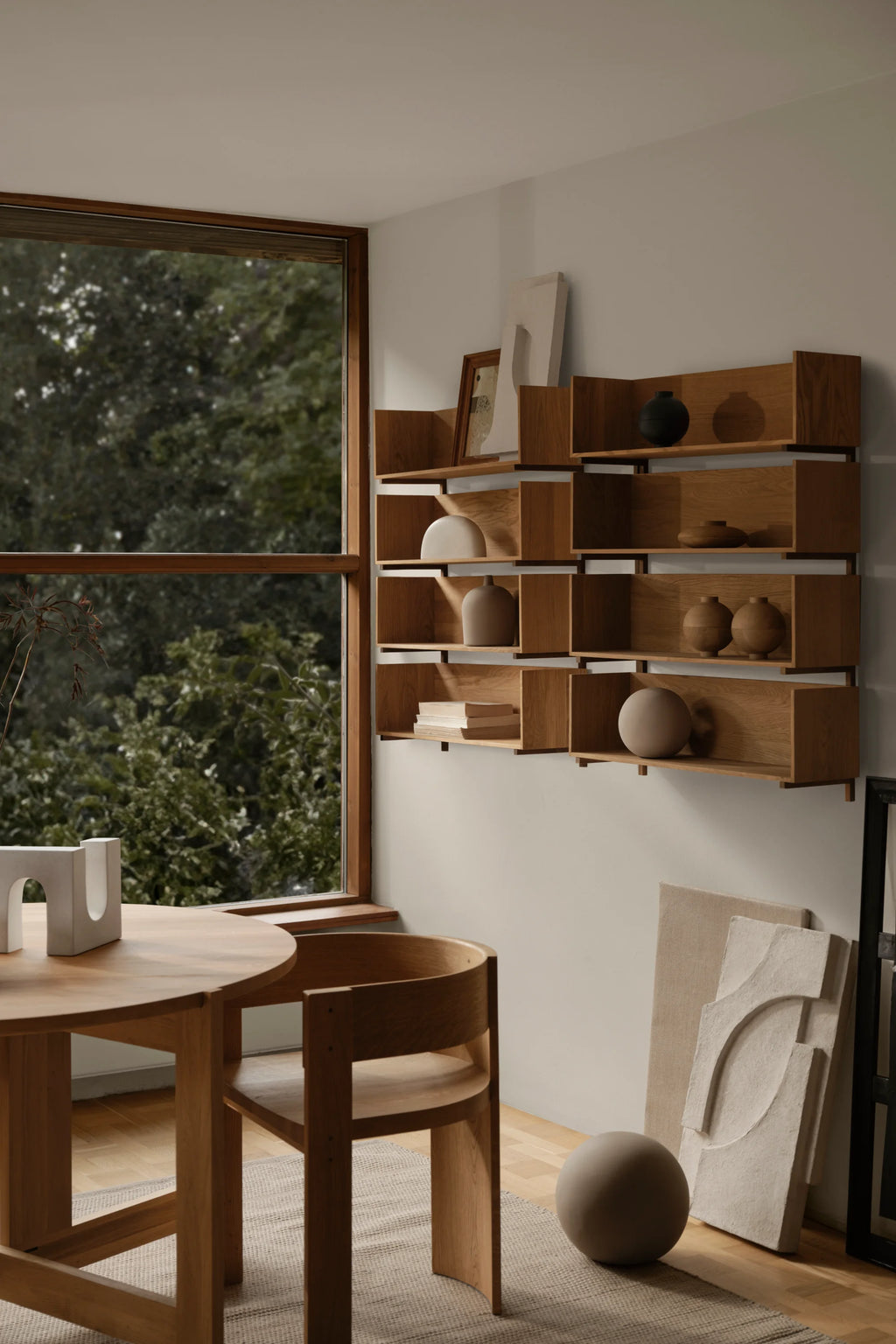 Kristina Dam Stack Wall Shelf, a modern minimalist wall-mounted shelving unit crafted from natural light oak wood with a modular, geometric design featuring stacked rectangular open compartments. This Scandinavian oak bookcase is perfect for displaying decor in contemporary living rooms, dining areas, or home offices.