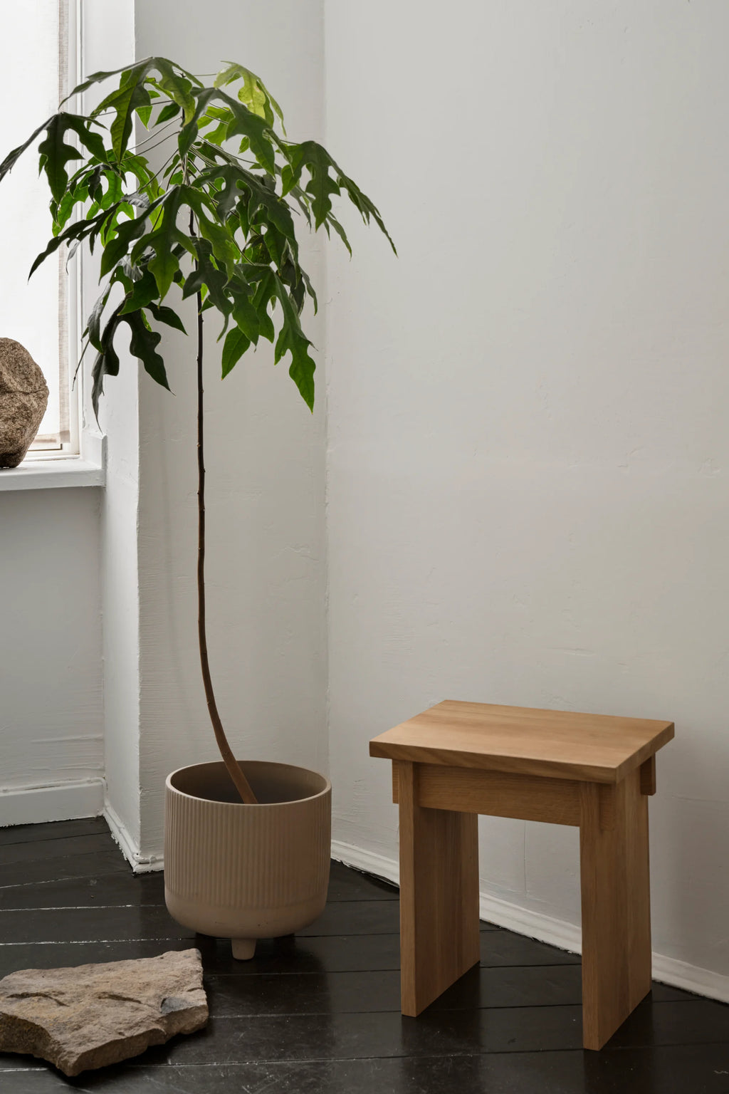 Kristina Dam Artisan Stool, a minimalist solid oak stool crafted from natural light wood with a sturdy, rectangular silhouette and clean, contemporary lines. This versatile wooden accent piece serves as a perfect bedside table, living room side table, or decorative plant stand for Scandinavian or organic modern interiors.