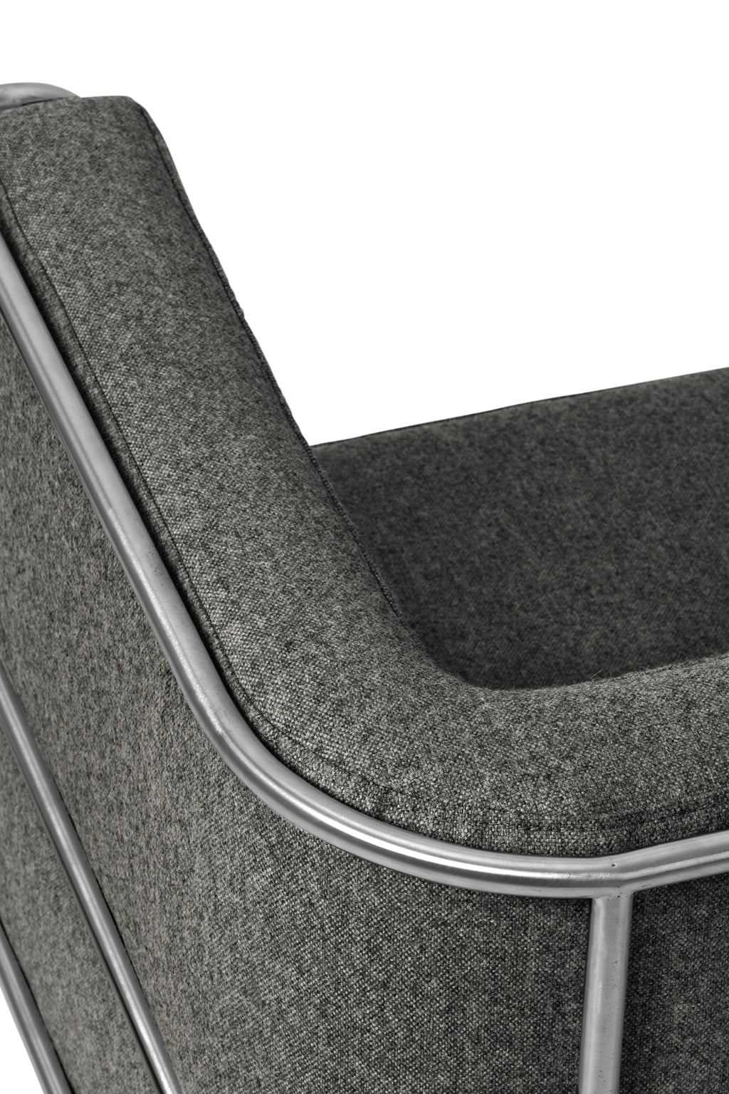 Kristina Dam Modernist Lounge Chair, a contemporary lounge chair featuring a sturdy matte silver metal frame with clean, architectural lines that cradle plush dark grey fabric upholstery.