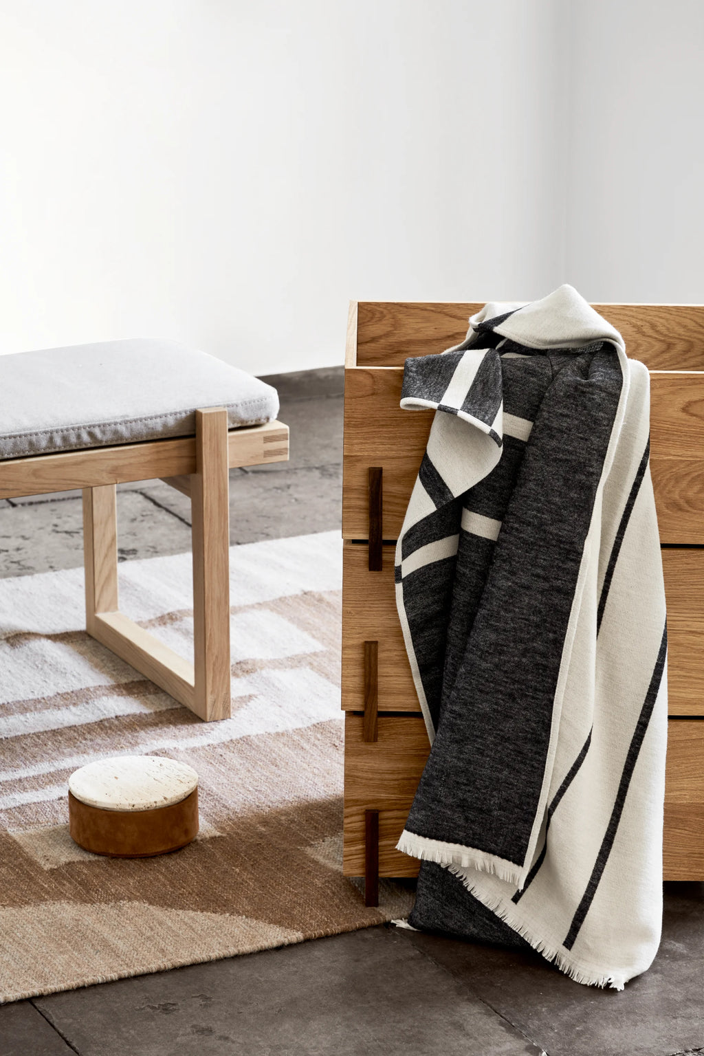 Kristina Dam Contemporary Kelim Rug, a hand-woven natural wool kelim rug featuring an abstract geometric pattern in warm earthy tones of beige, brown, and off-white. Its flatweave construction and subtle color variations create a textured, inviting surface for minimalist area rug styling. Ideal for Scandinavian living rooms, Japandi bedrooms, or organic modern interiors.