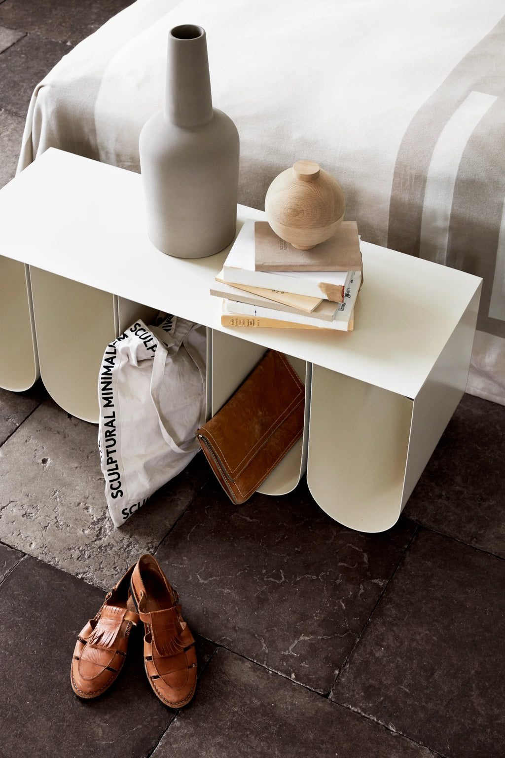 Kristina Dam Wooden Sphere, a minimalist decorative storage object crafted from natural light wood with a smooth, visible grain and a subtle cylindrical top. This round, organic modern wooden sphere functions as a stylish decorative box or accent piece. Ideal for Scandinavian shelf styling, contemporary living rooms, or modern bedroom decor.