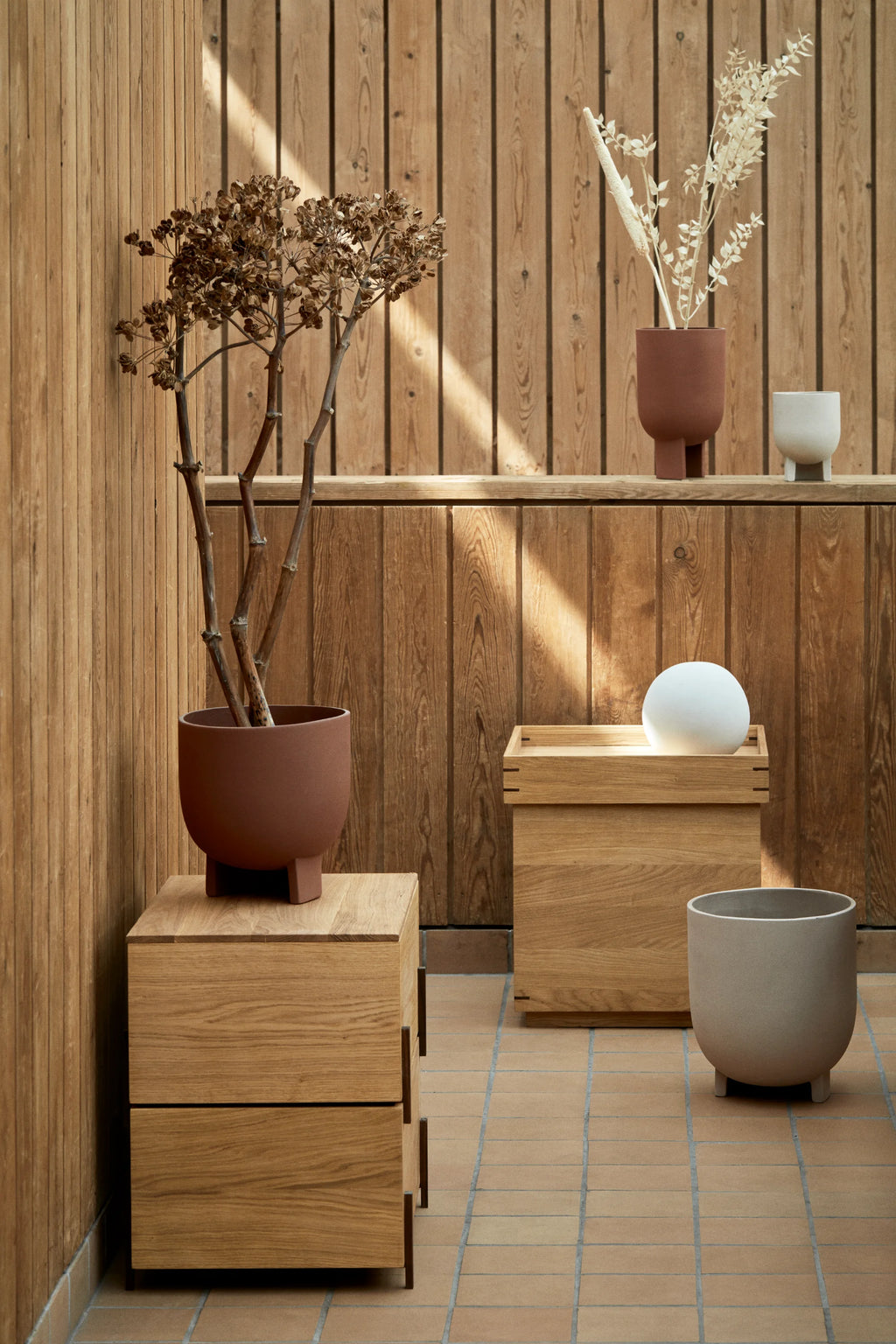 Kristina Dam Stack Storage Box, a modular solid oak storage box showcasing natural light oak wood with a beautiful visible grain and smooth finish. This minimalist design features clean lines and sturdy finger joint construction, allowing for versatile stackable configurations. Perfect as a Scandinavian bedside table, modern minimalist side table, or elegant storage solution for contemporary living rooms.