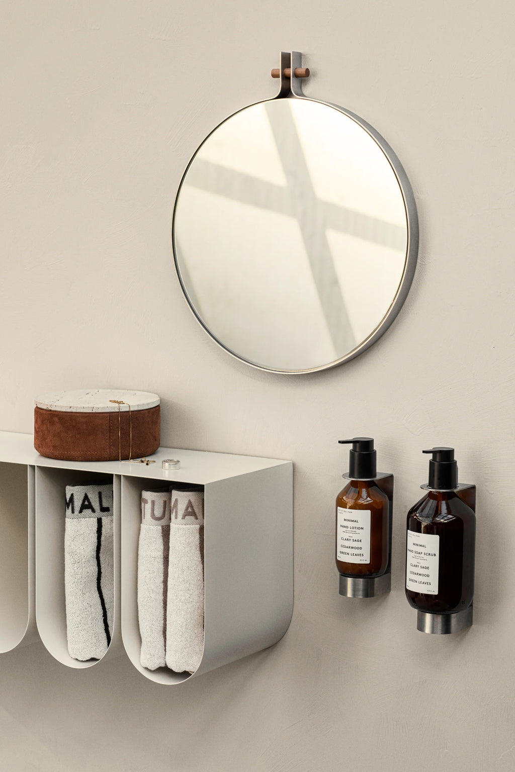 Kristina Dam Curved Wall Shelf, a modern minimalist wall-mounted shelf crafted from matte white powder-coated steel with a unique curved design and multiple compartments. This versatile Scandinavian storage shelf is perfect for organizing bathroom essentials, displaying decor, or as a functional entryway console for contemporary interiors.