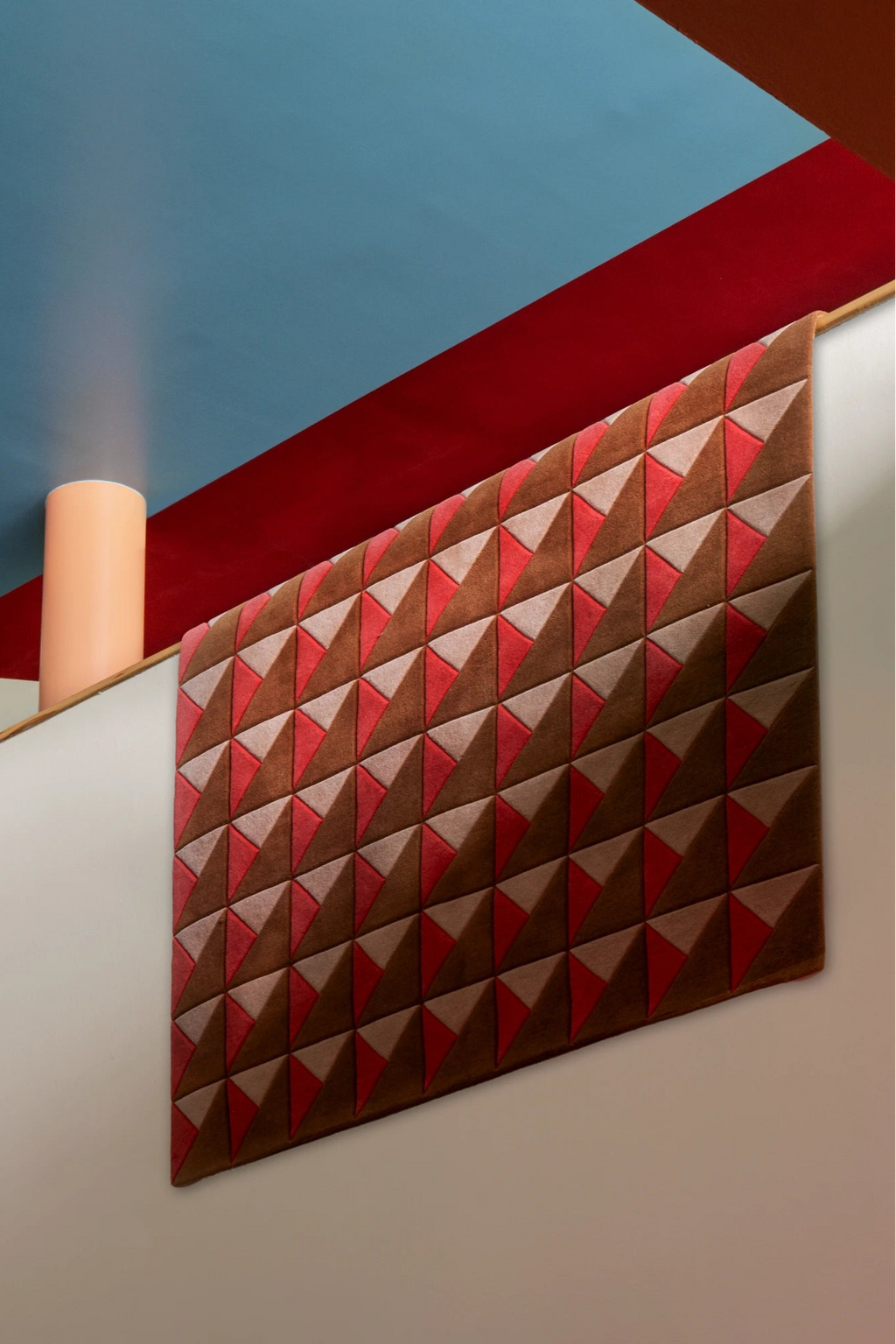 Layered Triangle Wool Rug, a modern brown, red, and beige geometric area rug with a striking 3D triangle pattern. Perfect for adding contemporary style and warmth to living rooms or entryways.