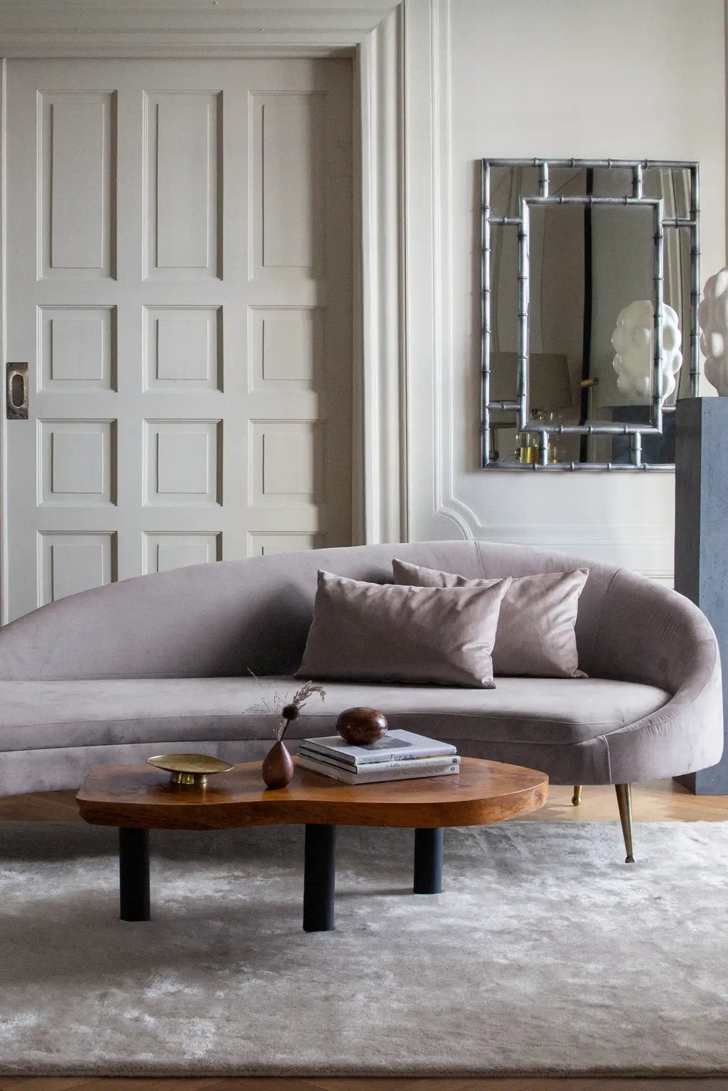 Layered Artisan Wool Rug, a luxurious light grey or off-white wool area rug with a soft, plush texture. Perfect for adding warmth and sophisticated style to a living room or bedroom.