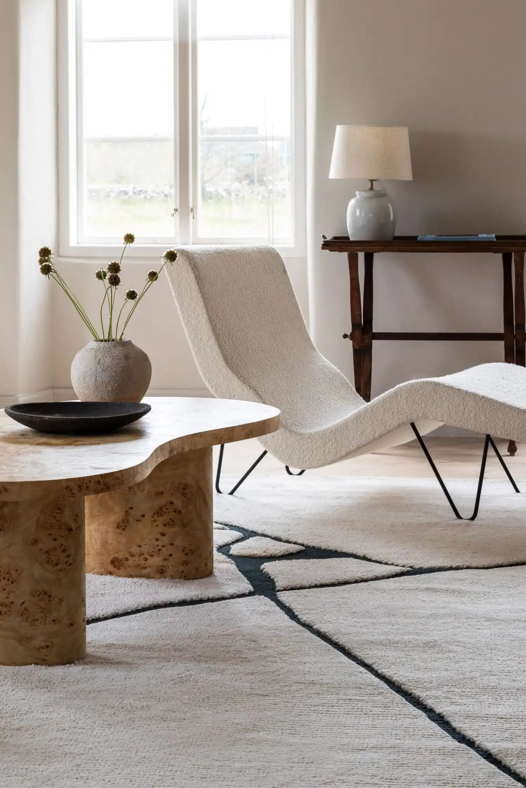Layered Gute Wool Rug, a plush off-white textured wool area rug with abstract dark grey intersecting lines, showcasing a modern organic design. Perfect for elevating contemporary living room or bed...