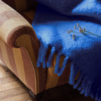 Hand-knitted chunky mohair blanket in warm caramel shade