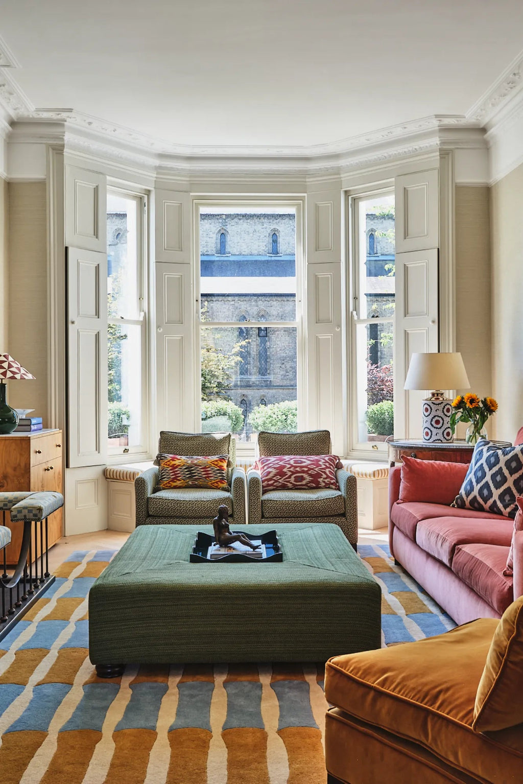 Layered Bamboo Forest Wool Rug, a modern low pile area rug in a vibrant blue, gold, and cream abstract bamboo stripe pattern. Perfect for adding a natural, artistic touch to contemporary living spa...