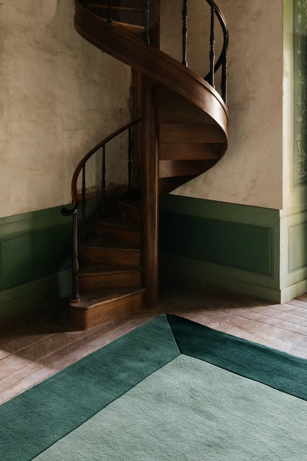 Layered Box Wool Rug, a plush green and light green color-blocked area rug with a modern geometric design, featuring a soft wool pile. Perfect for adding contemporary style and comfort to living ro...