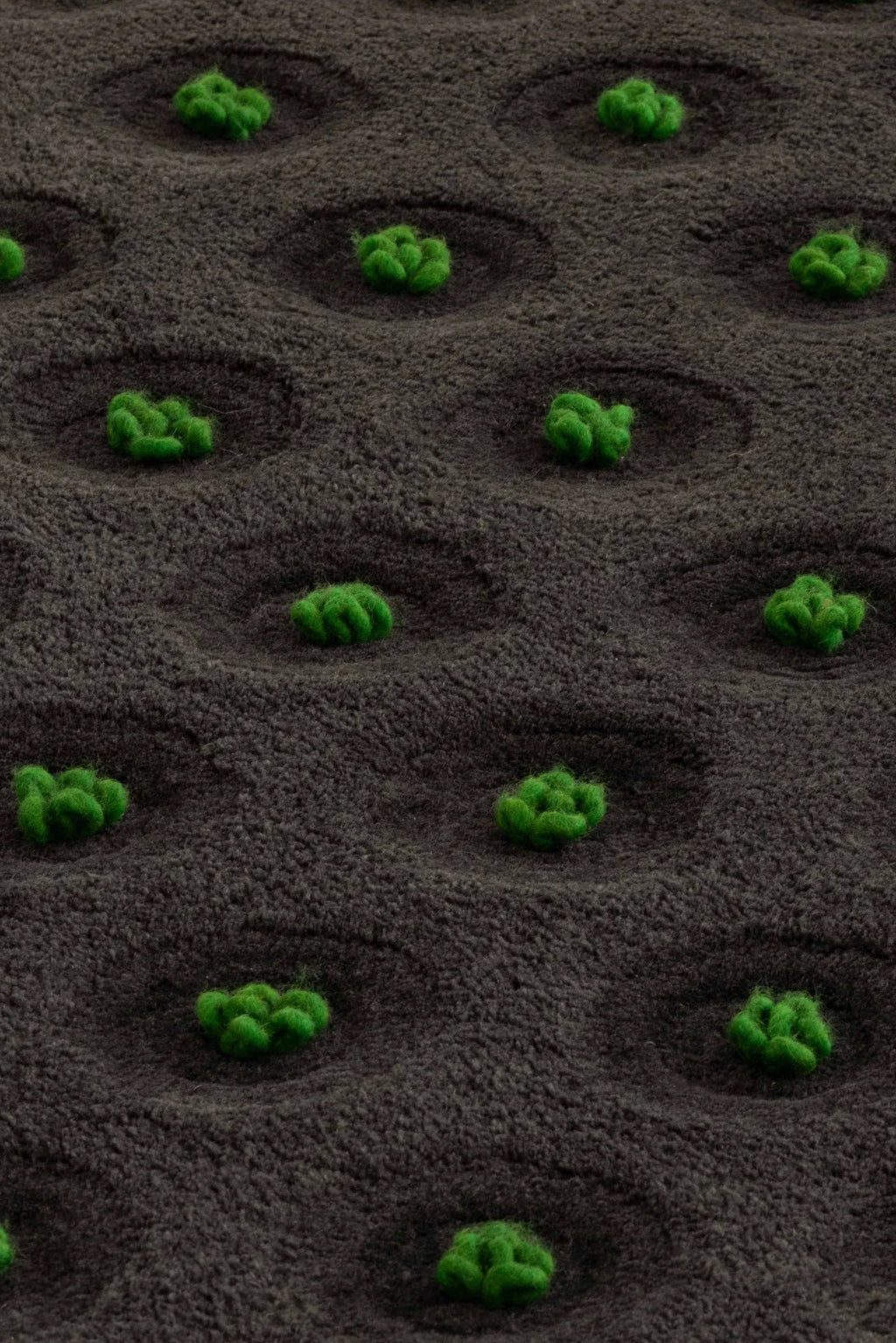 GAN Rugs La Geria-Lanzarote Rug, a hand-tufted wool area rug showcasing a unique organic modern design with a deep, plush charcoal grey pile.