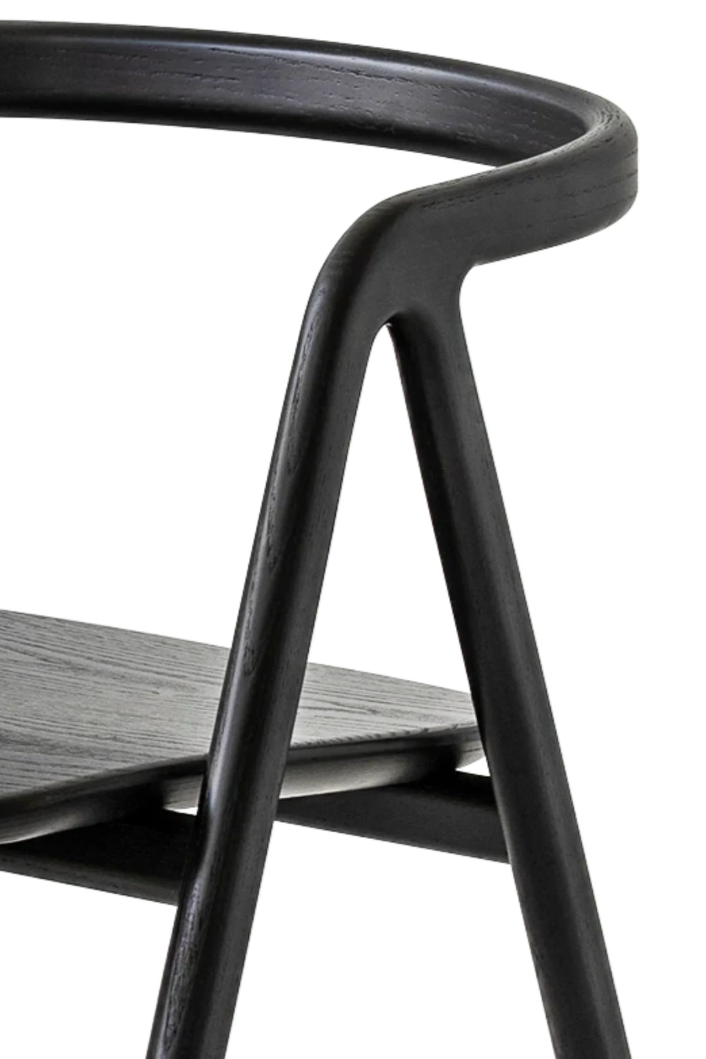 Made by Choice Laakso Dining Chair, a close-up detail shot of the elegant black wooden frame, showcasing the smooth curves and fine grain texture of the premium material, against a clean white background.