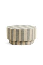 Round ottoman with striped pattern on a white background