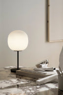 Antique style lantern table lamp with intricate metalwork and warm ambient glow