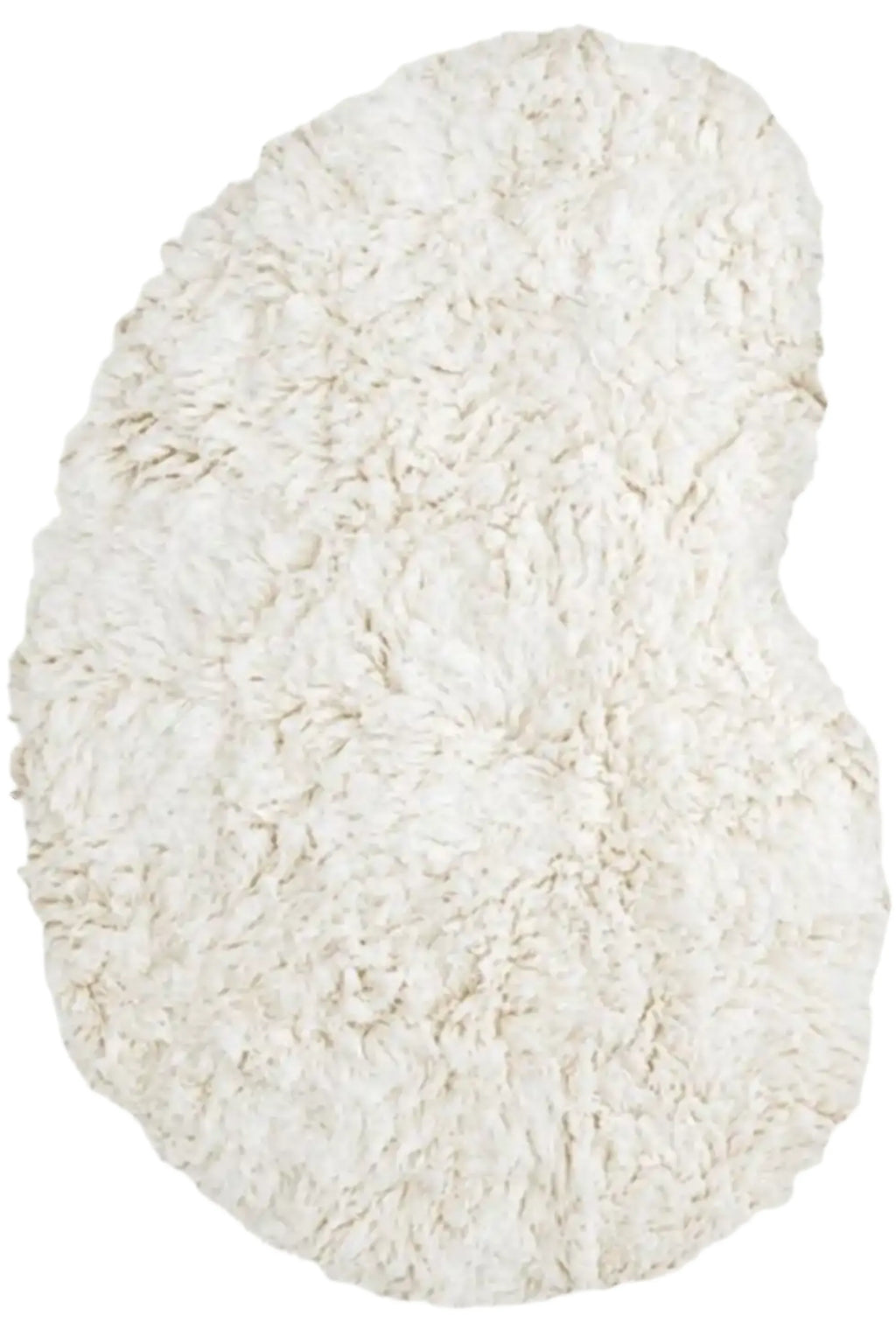 Layered Residue Shaggy Wool Rug, a plush off-white natural wool rug with a soft, textured shaggy pile and an organic, irregular shape. Perfect for adding warmth and bohemian style to any living roo...