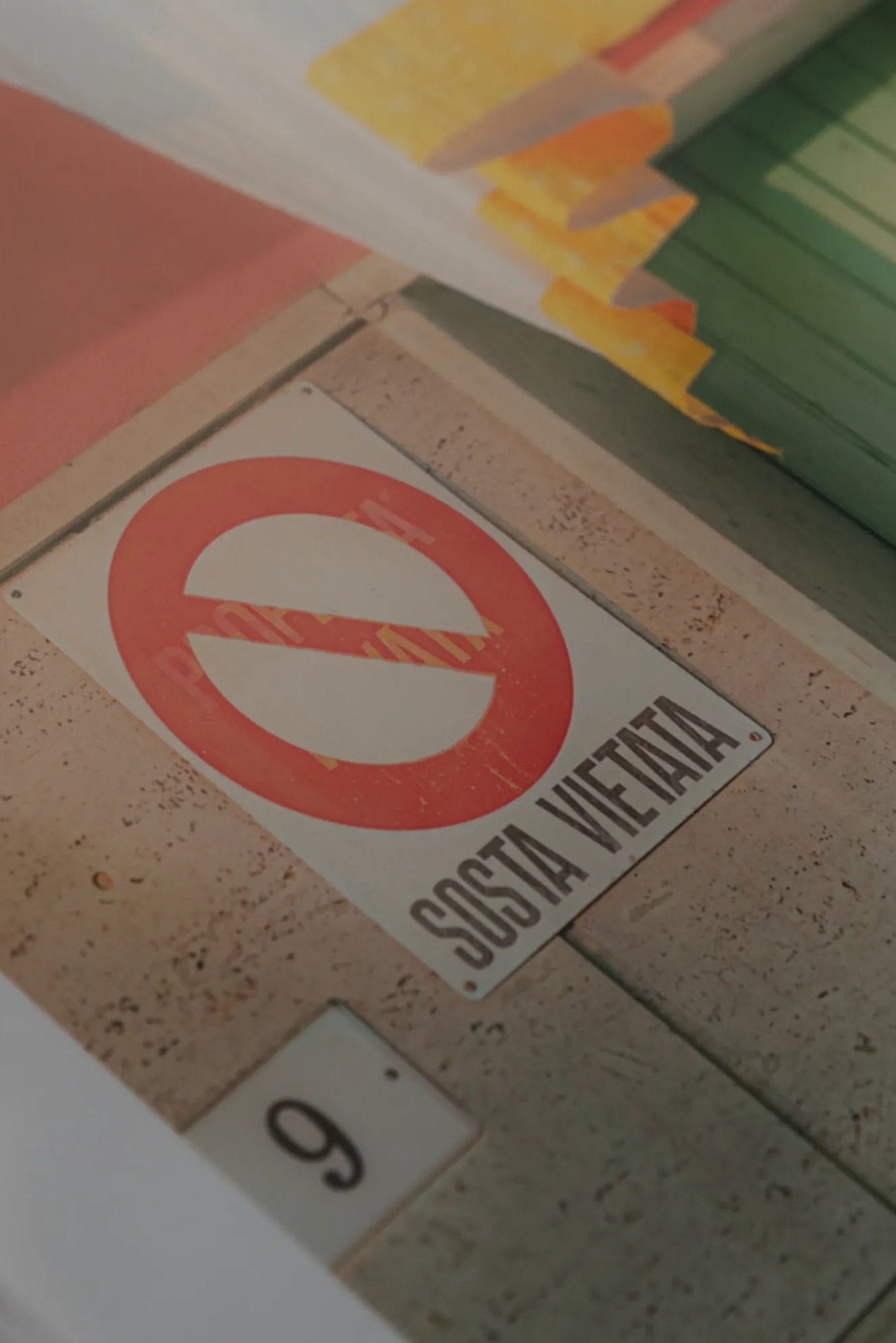 Alt text: The beautiful coastal town of Camogli surrounded by colorful buildings and clear blue waters on a sunny day