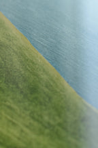 Close-up of Dorset handbag's intricate stitching and embossed logo