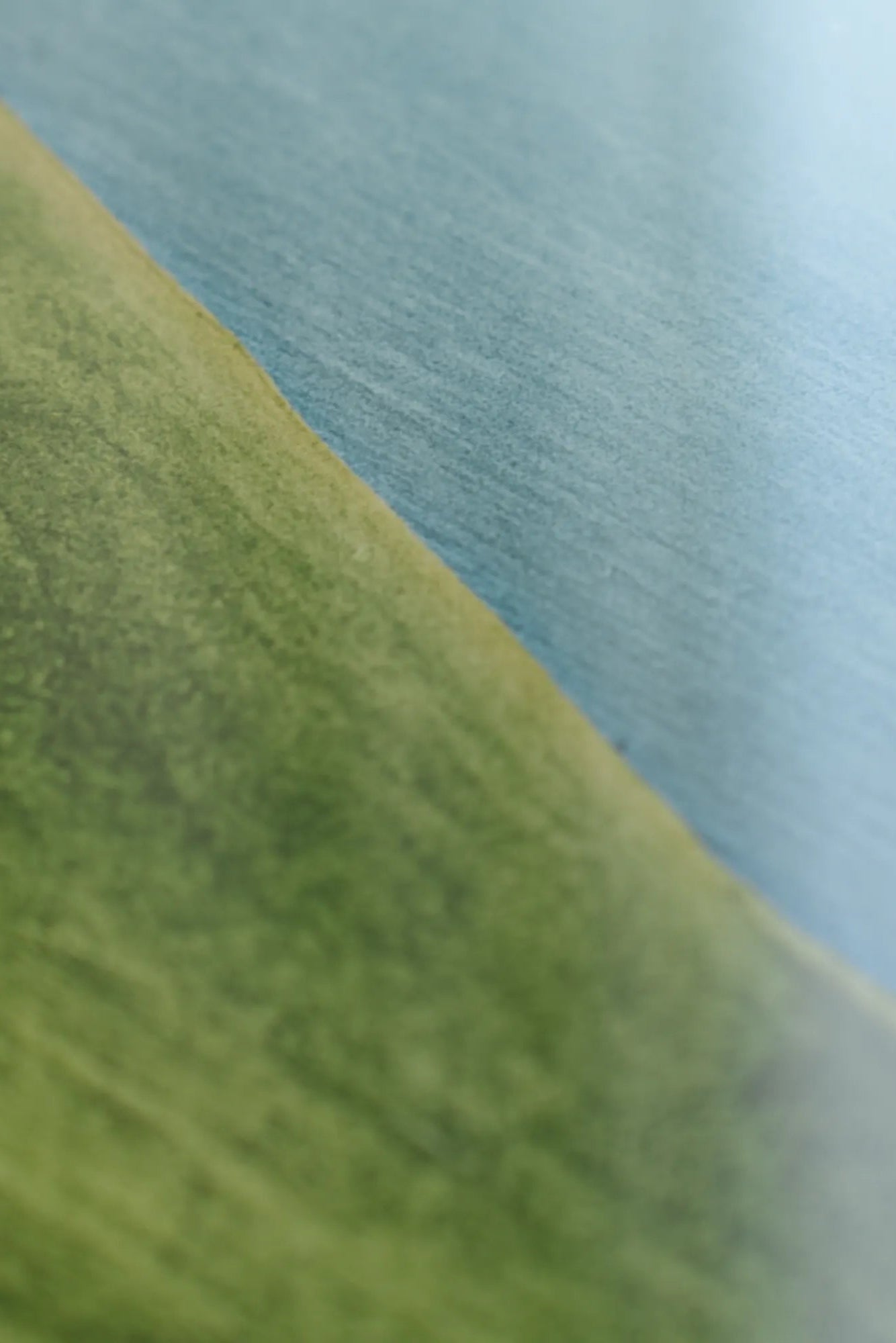 Close-up of Dorset handbag's intricate stitching and embossed logo