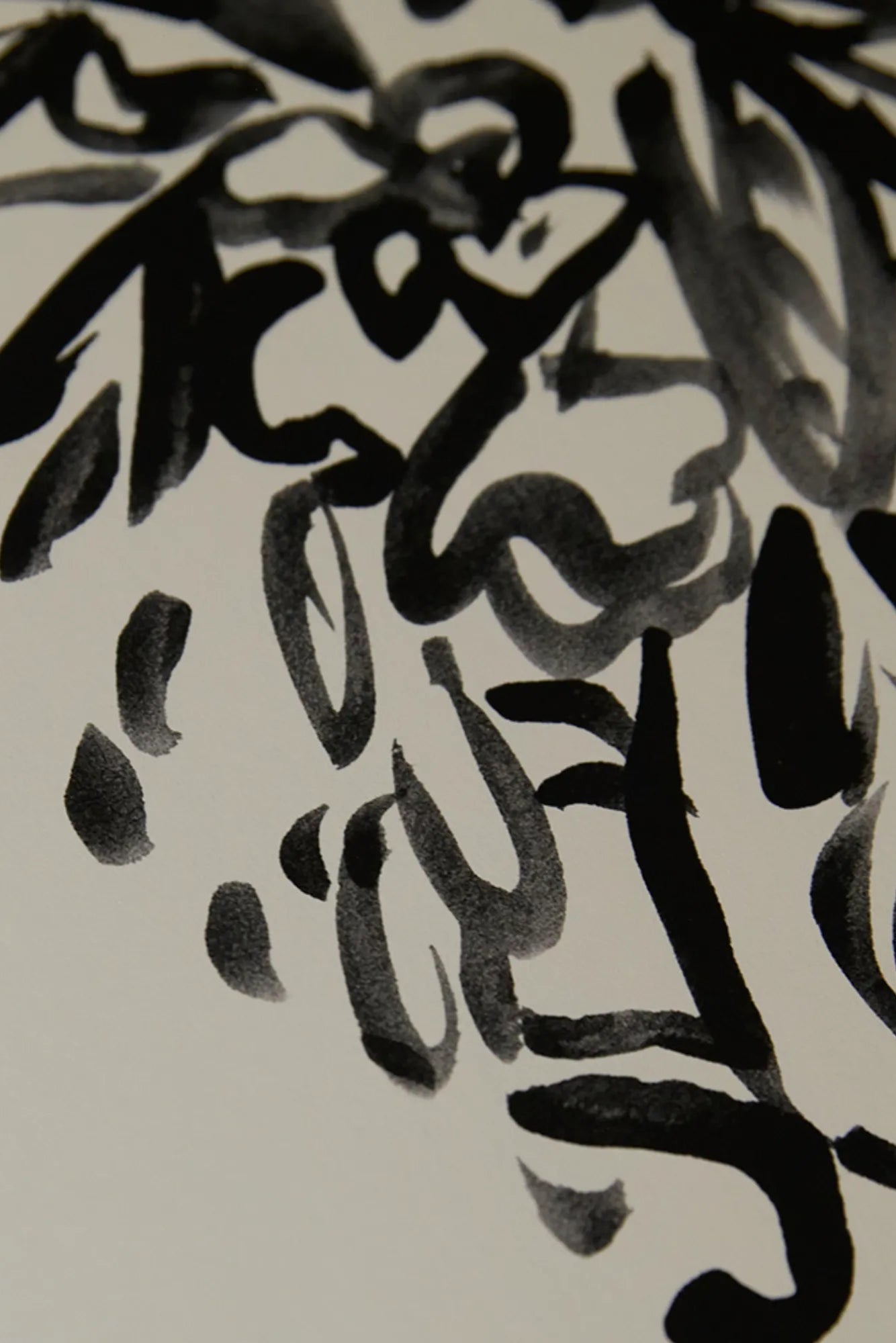 Sympathy bouquet with white lilies and roses in a black vase