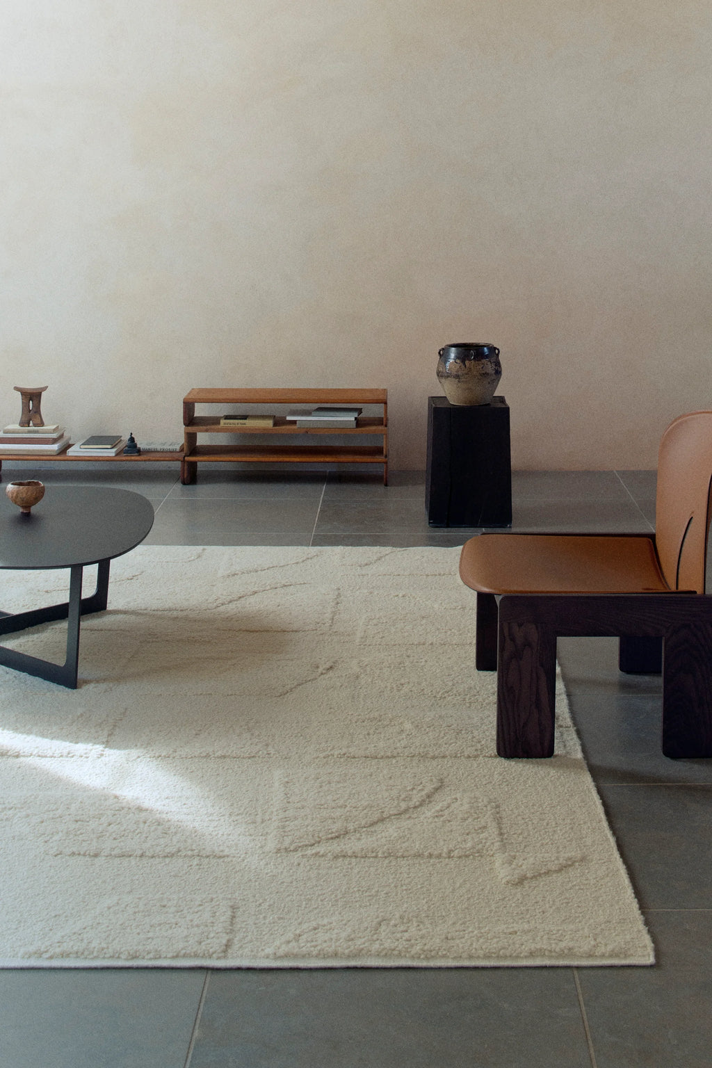 Linie Design Polar Angels Wool Rug, a luxurious cream-colored wool area rug featuring a plush, high-pile texture with a subtle, organic carved pattern. This natural undyed wool rug offers soft, inviting warmth and minimalist elegance, perfect for enhancing modern minimalist living rooms, Scandinavian bedrooms, or cozy contemporary spaces.