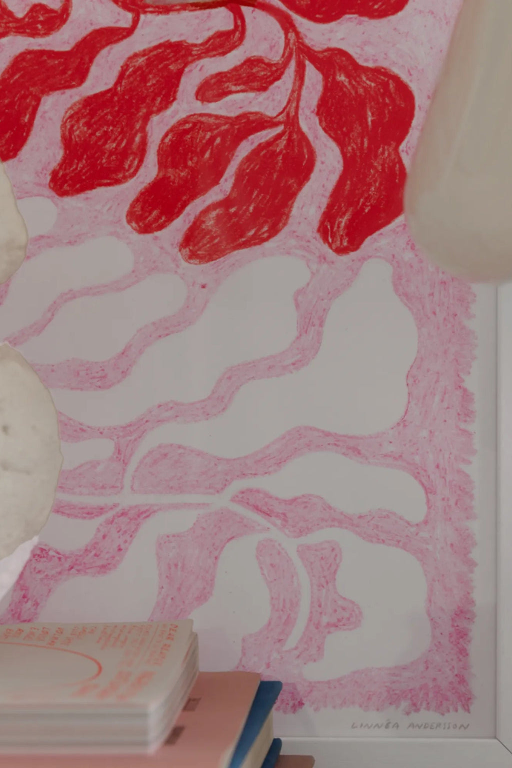 The Poster Club Longing, an abstract art print by Linnéa Andersson featuring bold red organic leaf-like shapes and wavy light pink crayon-textured lines on a crisp white background. This contemporary poster adds a vibrant, organic modern touch, perfect for gallery wall art in living rooms, bedrooms, or creative studio spaces.