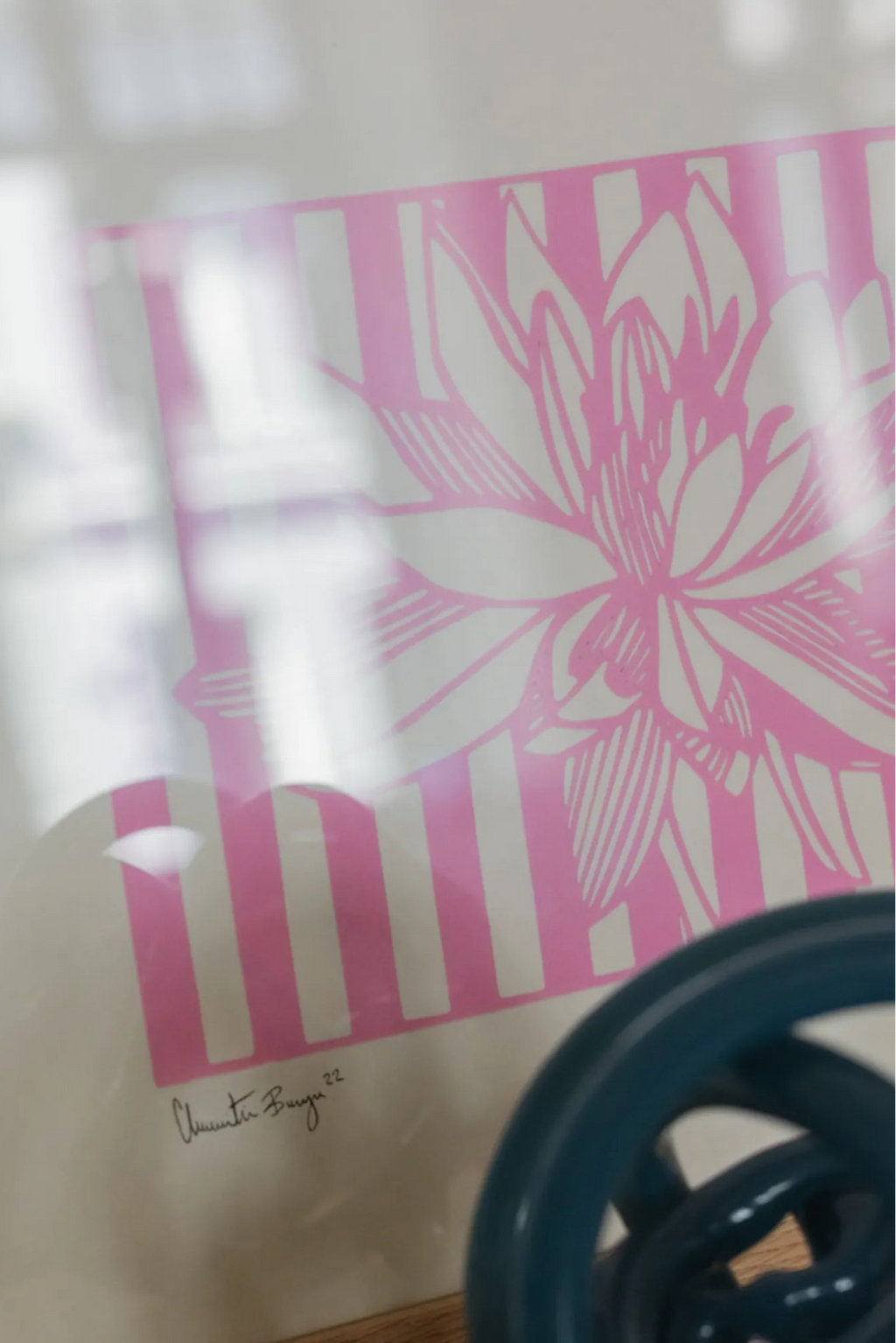 The Poster Club Lotus No 01, a vibrant abstract floral art print featuring a white lotus flower with detailed pink outlines and shading, set against a bold background of alternating bright pink and white vertical.