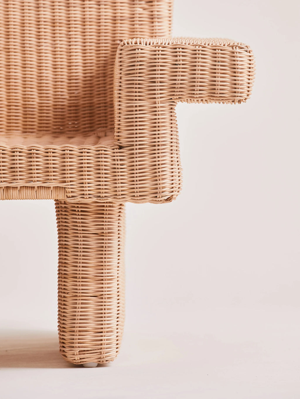 Heaps & Woods Louis Lounge Chair w/ Armrest, a chunky natural hand-woven rattan lounge chair featuring a distinctive sculptural armrest and thick leg, crafted with intricate weaving in a light, warm beige tone. This organic modern rattan chair offers a unique textured look, perfect as a statement piece for a coastal living room, boho bedroom, or contemporary sunroom.