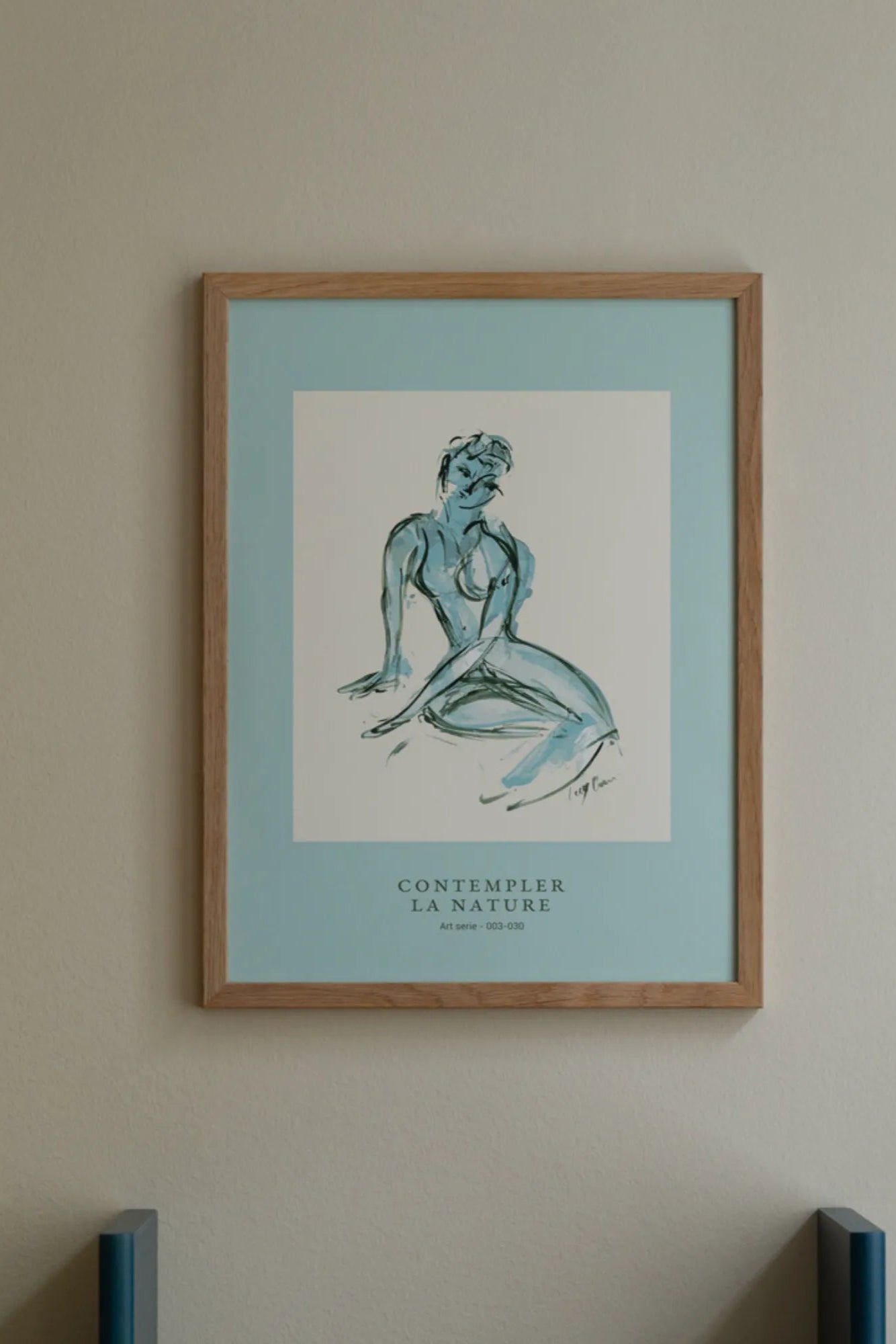 Contempler la Nature - A majestic waterfall cascading down a rocky cliff surrounded by dense forest