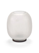 A front view of the Lumen Wind Light when unlit, showing its smooth, round, frosted, matte white glass globe with a circular opening at the top. It rests on a thin, dark circular base. The light is photographed on a clean white background.
