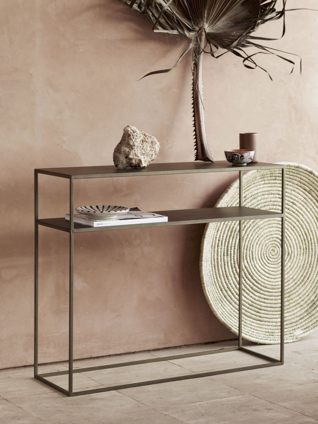 Tine K Metal Console Table, a sleek industrial chic console table crafted from dark bronze metal with a subtle brushed finish, featuring two clean-lined rectangular shelves and an open minimalist frame. This versatile contemporary shelving unit is perfect for entryway decor, living room display, or modern home office organization.