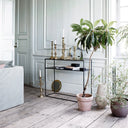 Industrial style metal console table with distressed finish and wooden shelves