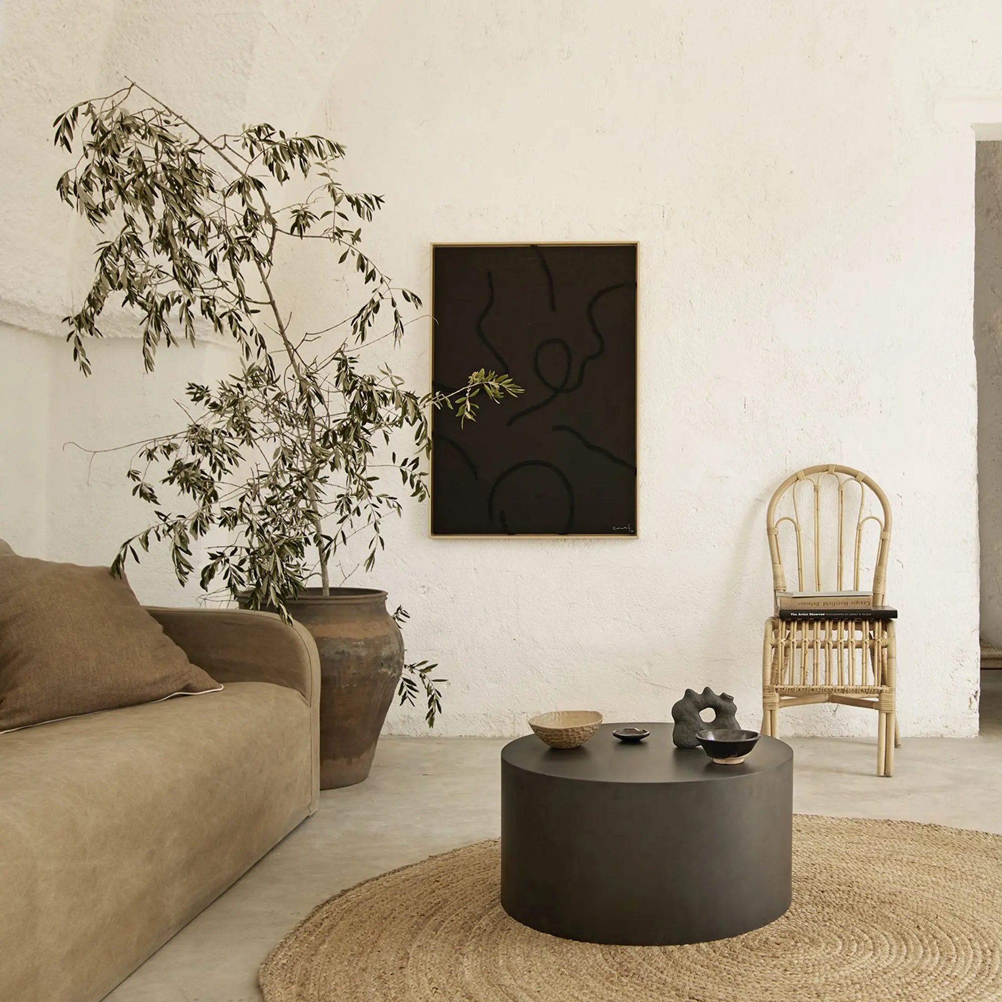 Oval metal coffee table with mirrored surface and elegant curves
