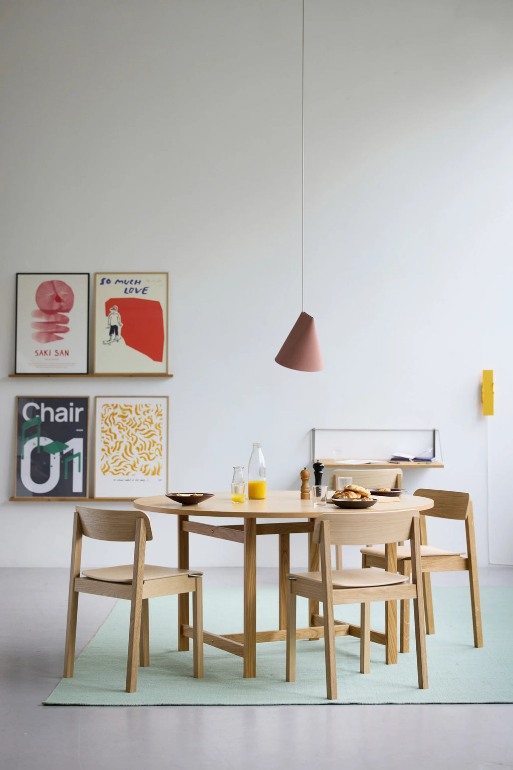 MOEBE Everyday Chair, a Scandinavian dining chair crafted from light natural oak wood, featuring a minimalist design with clean lines, a subtly curved backrest, and a solid wood frame. Its pale blonde wood tones and simple silhouette make it a versatile contemporary wooden chair for modern interiors. Ideal for modern dining rooms, minimalist kitchens, or as a stylish natural wood accent chair.