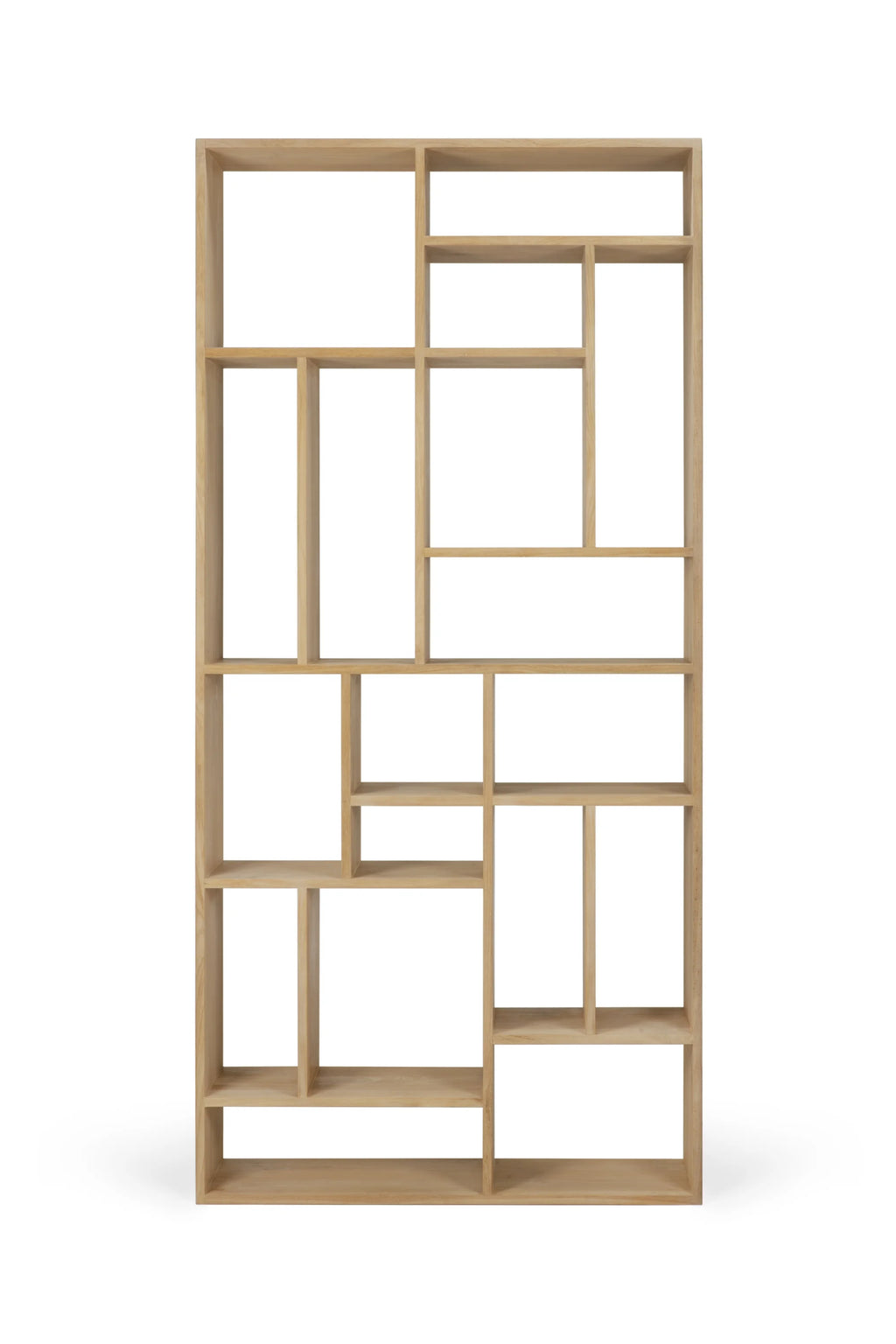 Ethnicraft M Rack, a modern minimalist shelving unit crafted from solid oak wood. It features an asymmetrical, geometric design with various open compartments, creating a contemporary and artistic display for books and decor. The natural light oak finish highlights the subtle wood grain, offering a warm and organic modern aesthetic, ideal for living rooms, dining rooms, or home offices in Scandinavian or contemporary interiors.