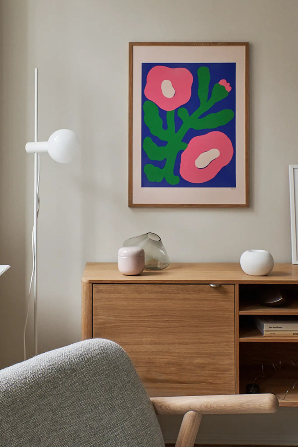 Vibrant pink poppies blooming in a lush garden under the bright sunlight