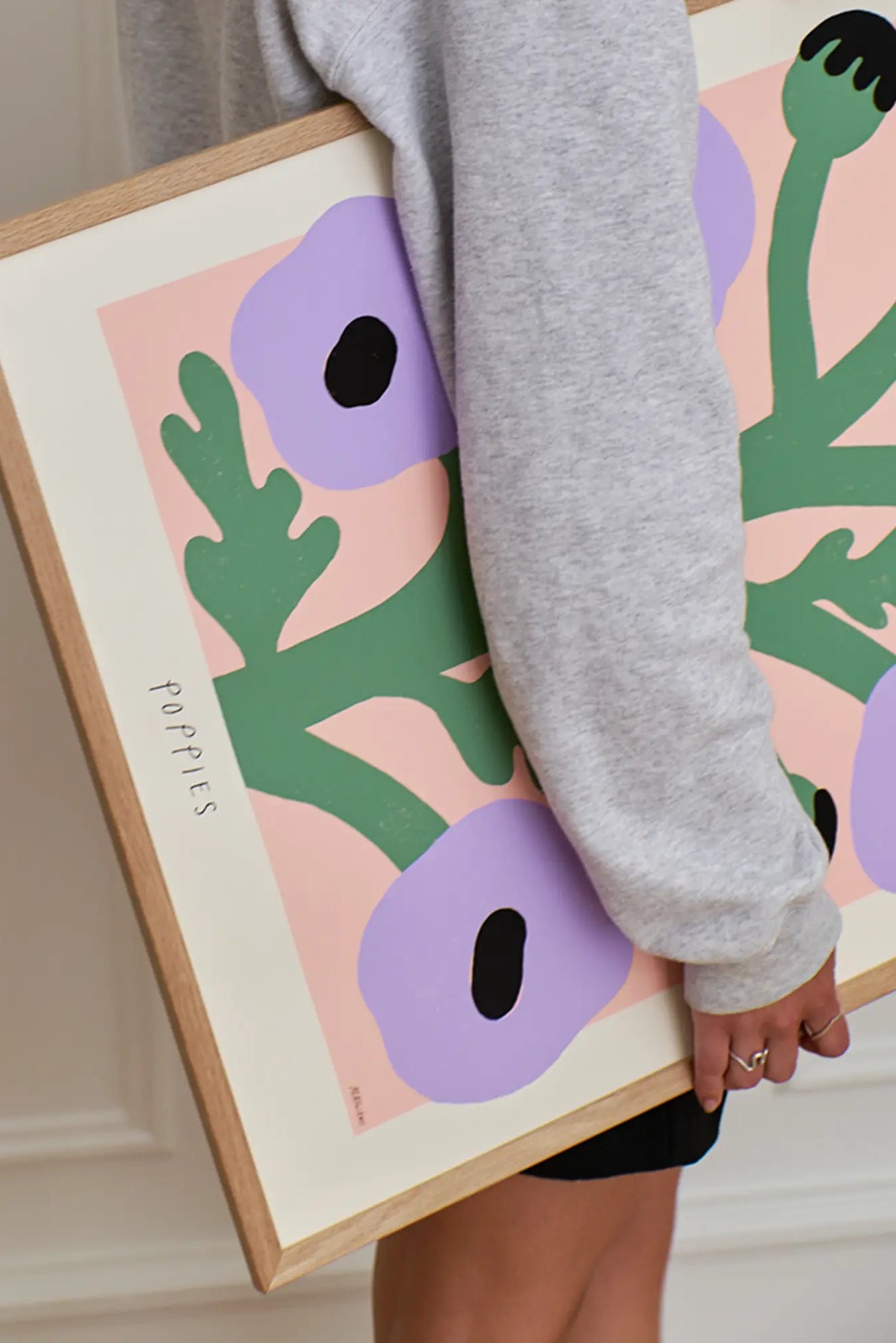 Group of purple poppies swaying in the breeze with a sunny, blue sky