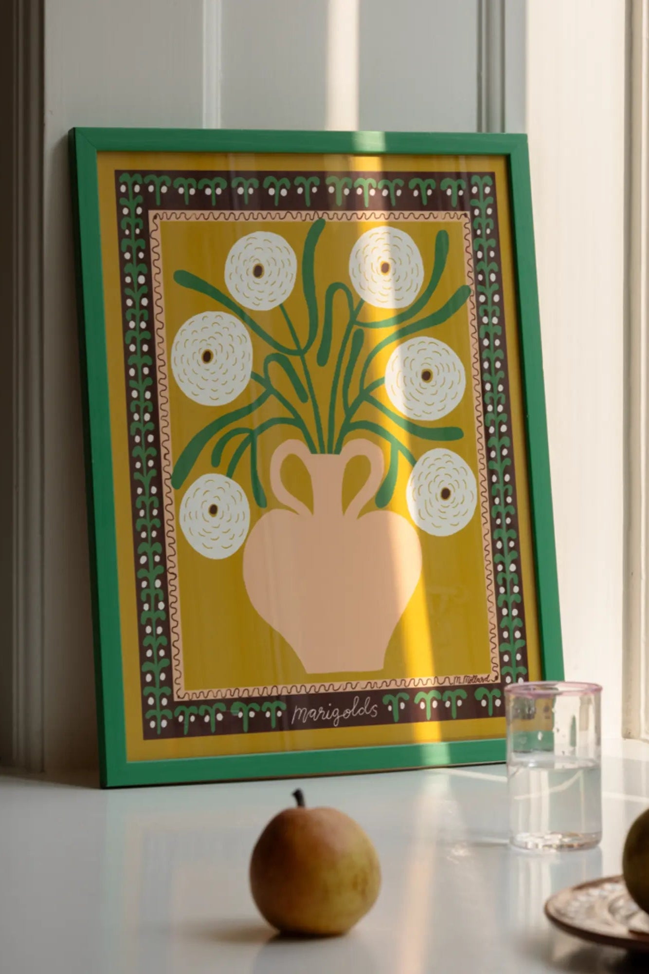 A close-up of white marigolds in a vase, showcasing their delicate petals and vibrant yellow centers