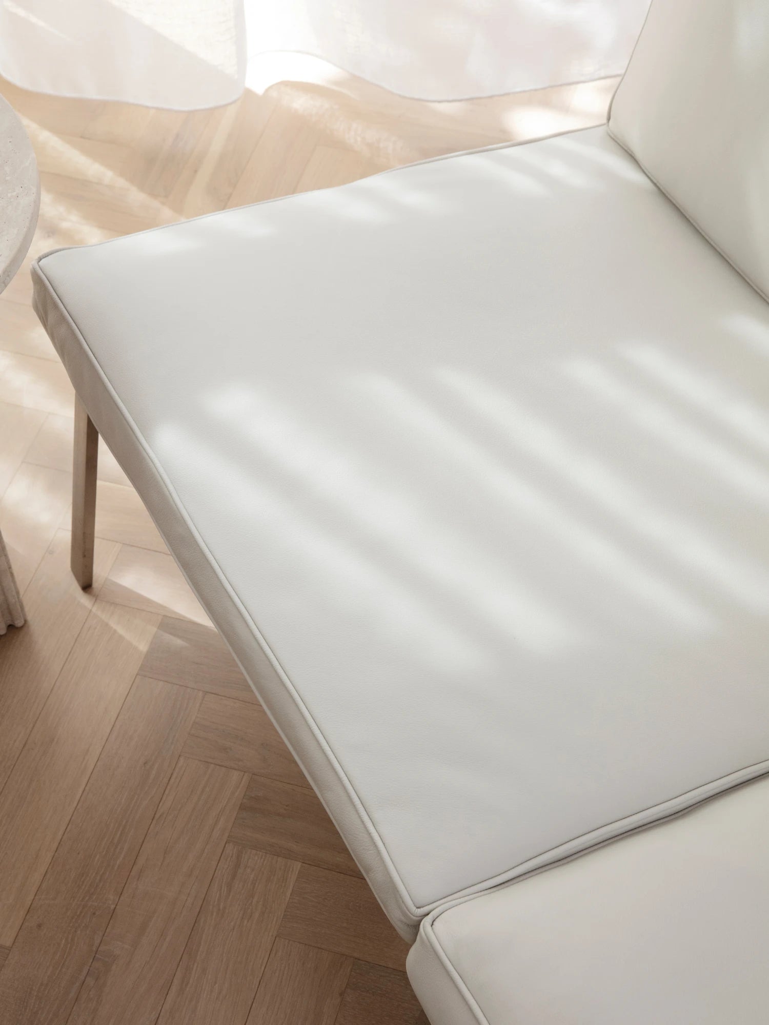 NORR11 Man 2 Seater Sofa, a modern minimalist 2-seater sofa featuring clean lines and plush cushions upholstered in premium light grey upholstery with subtle piping detail. Its contemporary Scandinavian design and compact size make it ideal for modern living rooms or stylish small apartment spaces.