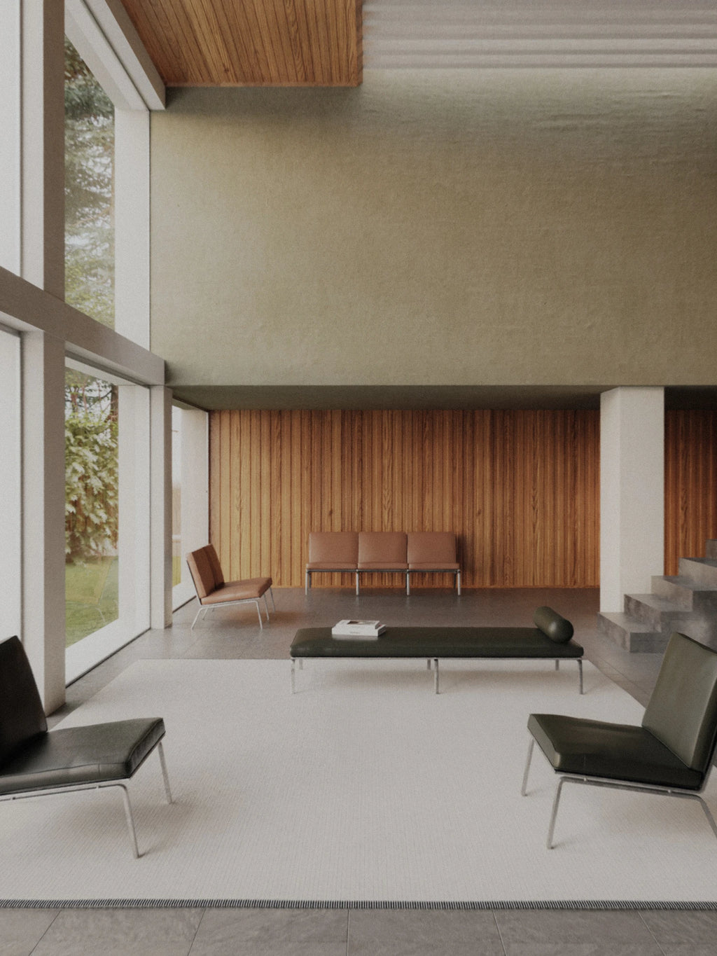 NORR11 Man 3 Seater Sofa, a sleek modern minimalist lounge sofa featuring deep dark olive green leather upholstery with a low-profile rectangular silhouette, clean lines, and a distinctive cylindrical bolster cushion. It rests on a polished silver metal frame, offering contemporary lounge seating for sophisticated living rooms, expansive entryways, or modern office waiting areas.