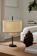 Sleek metallic margin table lamp with geometric base and white shade